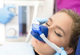 Woman with nitrous oxide mask